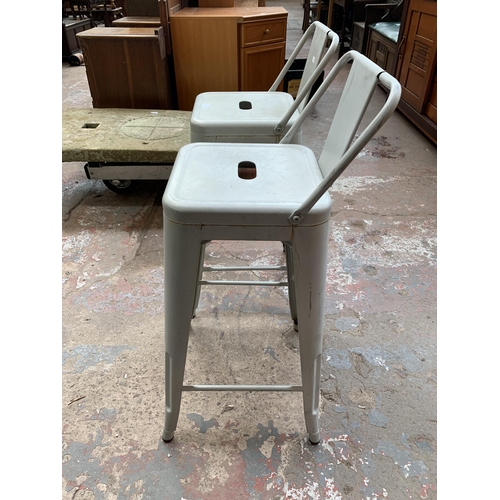 139 - A pair of industrial style metal bar stools