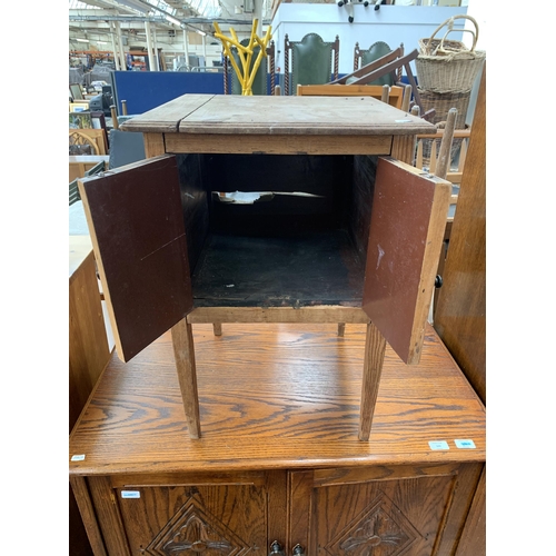 143 - An early 20th century pine two door side cabinet