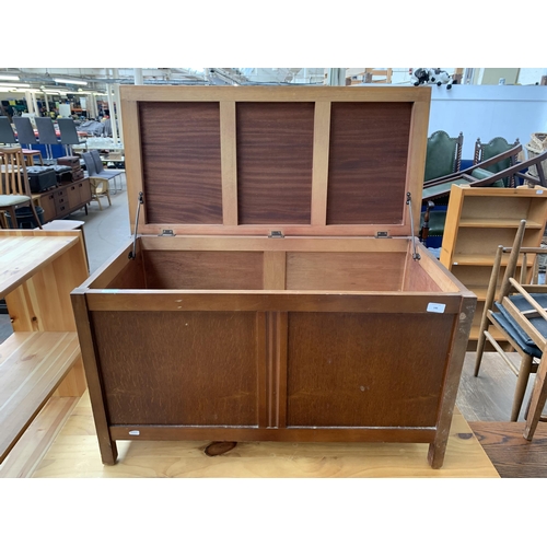 146 - A mid 20th century oak veneer blanket box - approx. 53cm high x 90cm wide x 44cm deep