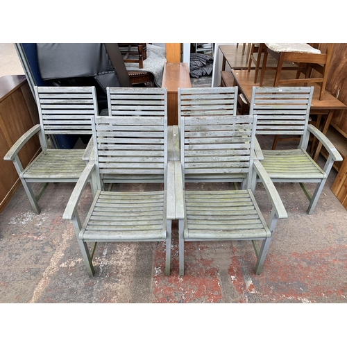 148 - Six grey painted wooden garden armchairs