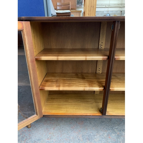 149 - A mahogany display cabinet - approx. 86cm high x 152cm wide x 30cm deep