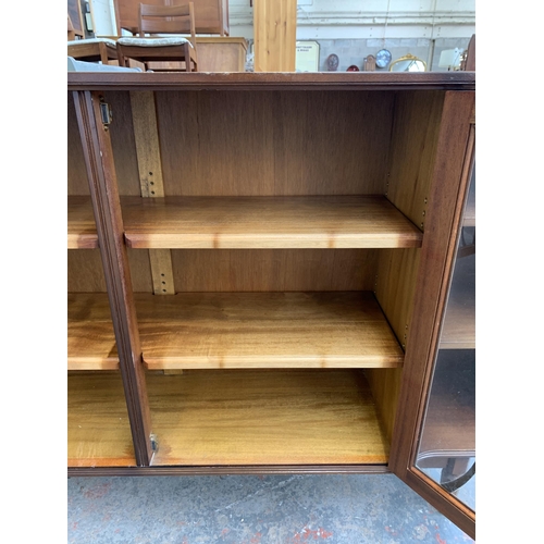 149 - A mahogany display cabinet - approx. 86cm high x 152cm wide x 30cm deep