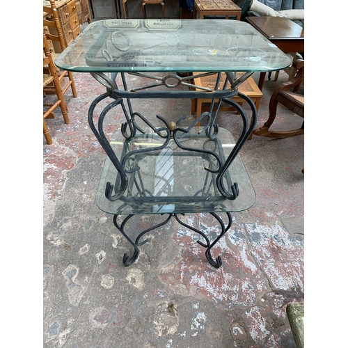 151 - A pair of wrought metal and glass top side tables - approx. 53cm high x 66cm wide x 66cm deep