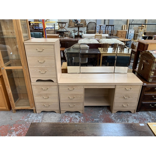 156 - An Alstons limed oak effect three piece bedroom suite comprising dressing table with mirror and two ... 