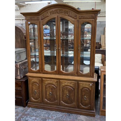 161 - A French style carved walnut display cabinet - approx. 209cm high x 143cm wide x 40cm deep