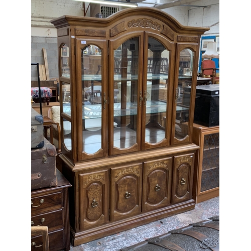 161 - A French style carved walnut display cabinet - approx. 209cm high x 143cm wide x 40cm deep