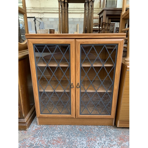 163 - A Homeworthy Furniture teak effect display cabinet