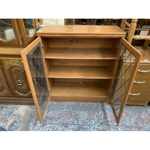 163 - A Homeworthy Furniture teak effect display cabinet