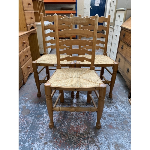 164 - Three 19th century style beech ladderback and rush seated dining chairs