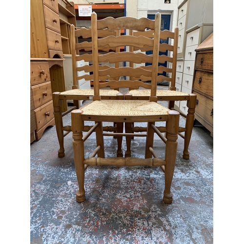 164 - Three 19th century style beech ladderback and rush seated dining chairs