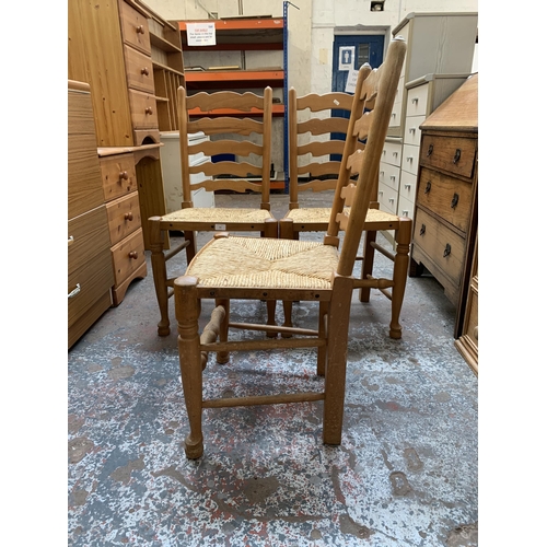 164 - Three 19th century style beech ladderback and rush seated dining chairs