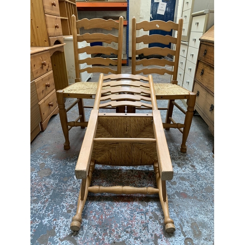 164 - Three 19th century style beech ladderback and rush seated dining chairs