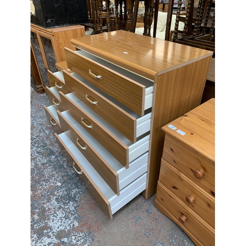 165 - A mid/late 20th century teak effect chest of drawers and bedside chest of drawers