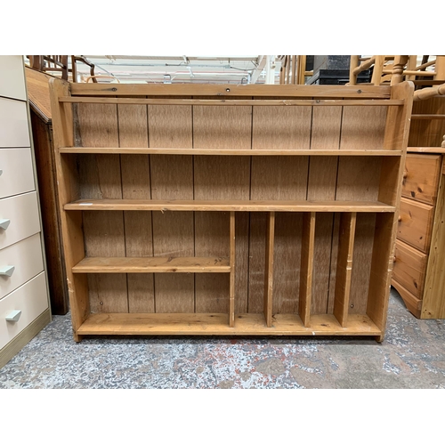 167 - A pine wall mountable shelving unit - approx. 89cm high x 109cm wide x 14cm deep