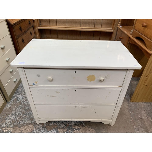 168 - A late 19th/early 20th century white painted chest of drawers - approx. 72cm high x 86cm wide x 48cm... 