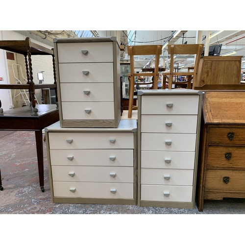 171 - Three late 20th century grey wood effect and white laminate chests of drawers