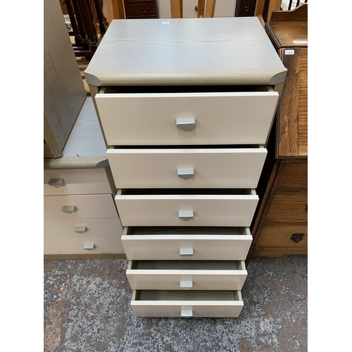 171 - Three late 20th century grey wood effect and white laminate chests of drawers