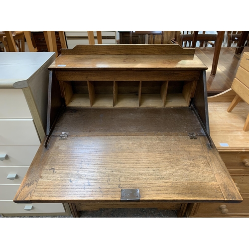 172 - An early 20th century oak bureau - approx. 106cm high x 76cm wide x 42cm deep