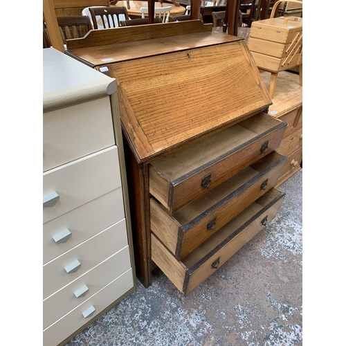 172 - An early 20th century oak bureau - approx. 106cm high x 76cm wide x 42cm deep