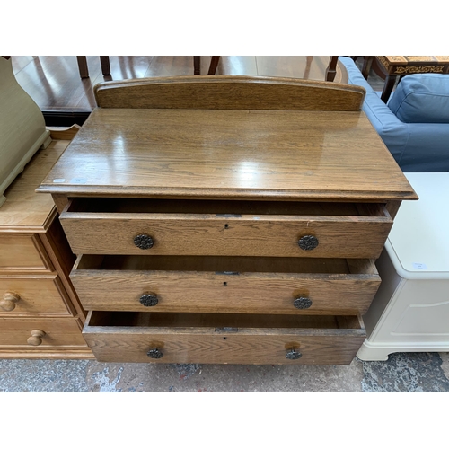 176 - An early 20th century oak chest of drawers - approx. 89cm high x 91cm wide x 46cm deep