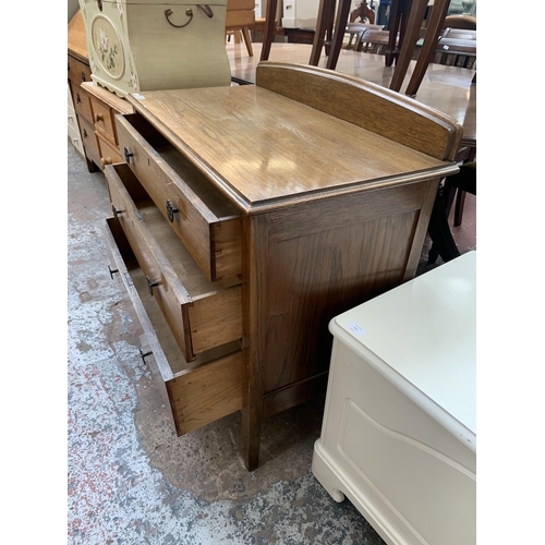 176 - An early 20th century oak chest of drawers - approx. 89cm high x 91cm wide x 46cm deep