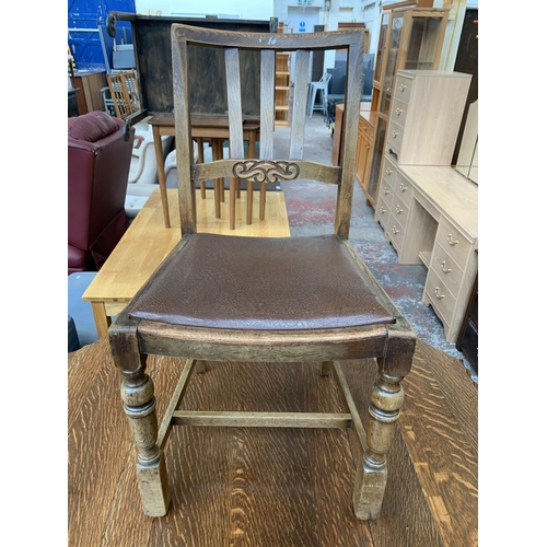 180 - An early 20th century oak pie crust edge drop leaf gate leg dining table on barley twist supports an... 