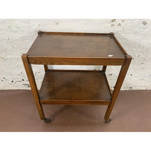 181 - An early/mid 20th century oak two tier tea trolley