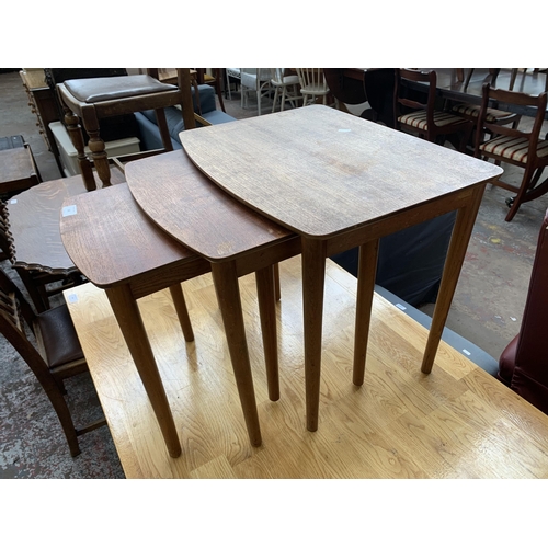 182 - A mid 20th century teak nest of tables - approx. 48cn high x 54cm wide x 40cm deep