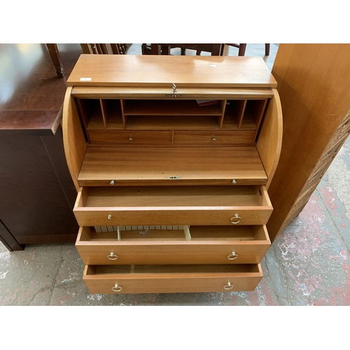 189 - A mid 20th century Remploy teak roll top bureau