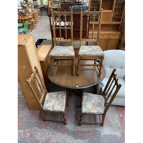 192 - An Ercol Old Colonial elm and beech drop leaf dining table and four Yorkshire dining chairs - table ... 