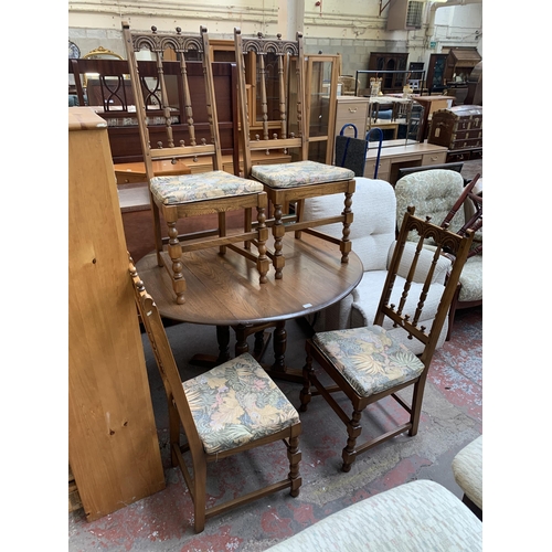 192 - An Ercol Old Colonial elm and beech drop leaf dining table and four Yorkshire dining chairs - table ... 