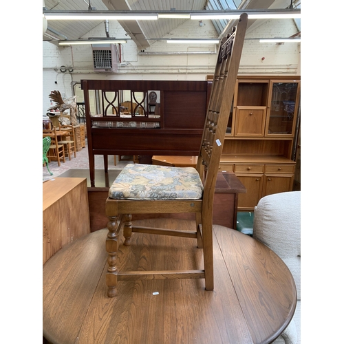 192 - An Ercol Old Colonial elm and beech drop leaf dining table and four Yorkshire dining chairs - table ... 