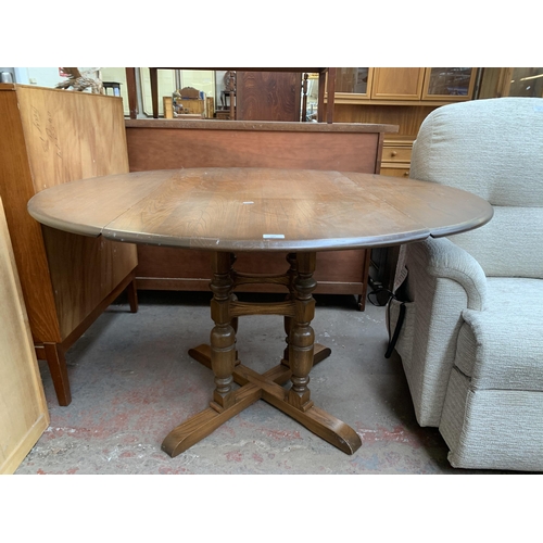 192 - An Ercol Old Colonial elm and beech drop leaf dining table and four Yorkshire dining chairs - table ... 