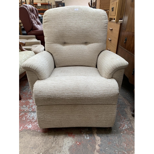 193 - A Sherborne fabric upholstered electric rise and recline armchair with remote control and power supp... 