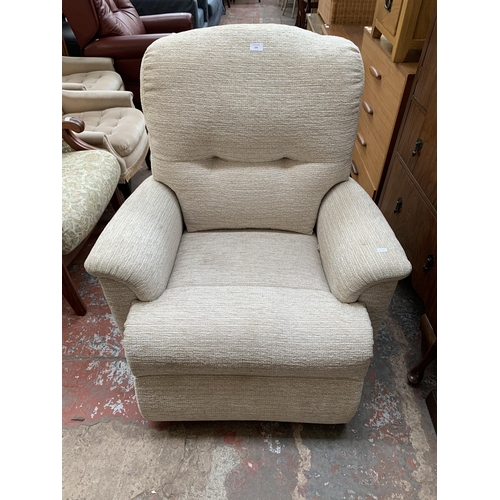 193 - A Sherborne fabric upholstered electric rise and recline armchair with remote control and power supp... 