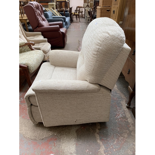 193 - A Sherborne fabric upholstered electric rise and recline armchair with remote control and power supp... 