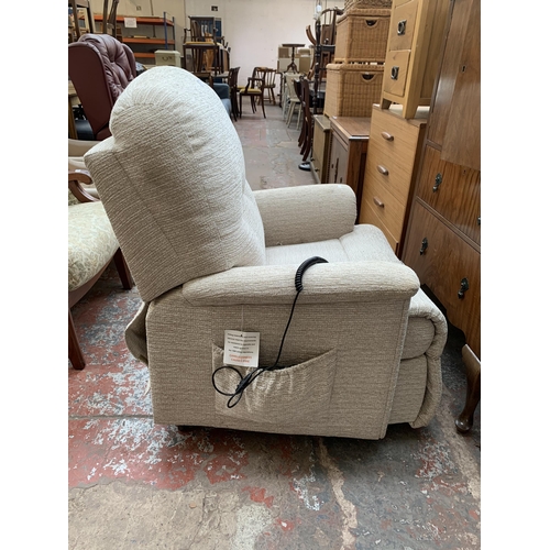 193 - A Sherborne fabric upholstered electric rise and recline armchair with remote control and power supp... 