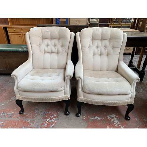 195 - A pair of late 20th century Victorian style button back fabric upholstered armchairs on cabriole sup... 