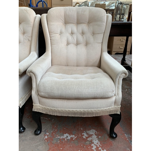 195 - A pair of late 20th century Victorian style button back fabric upholstered armchairs on cabriole sup... 