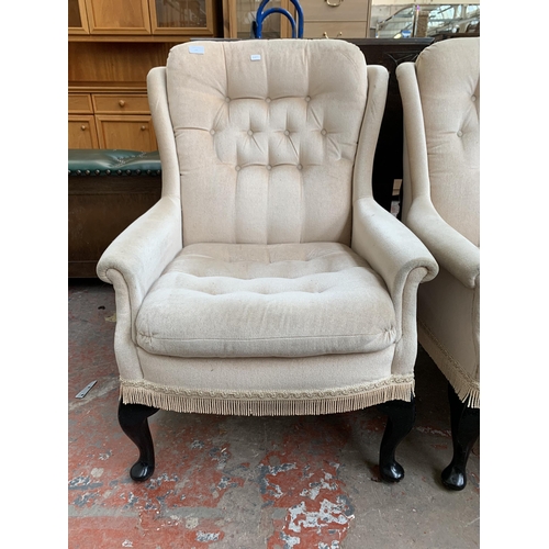 195 - A pair of late 20th century Victorian style button back fabric upholstered armchairs on cabriole sup... 