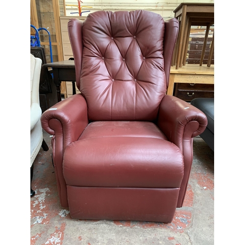 196 - A modern burgundy leather electric rise and recline armchair with remote control and power supply