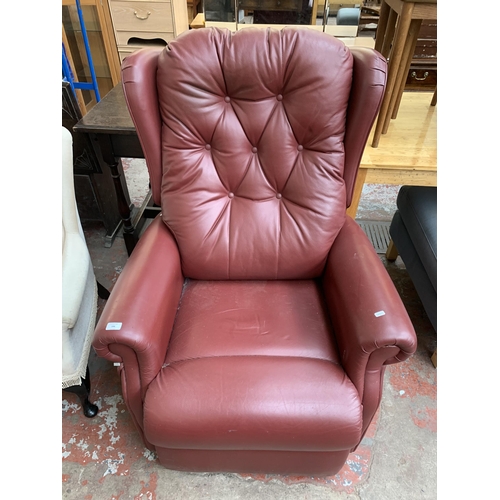 196 - A modern burgundy leather electric rise and recline armchair with remote control and power supply