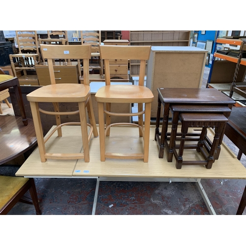 200 - Three pieces of furniture, one oak nest of tables and two IKEA beech dining chairs