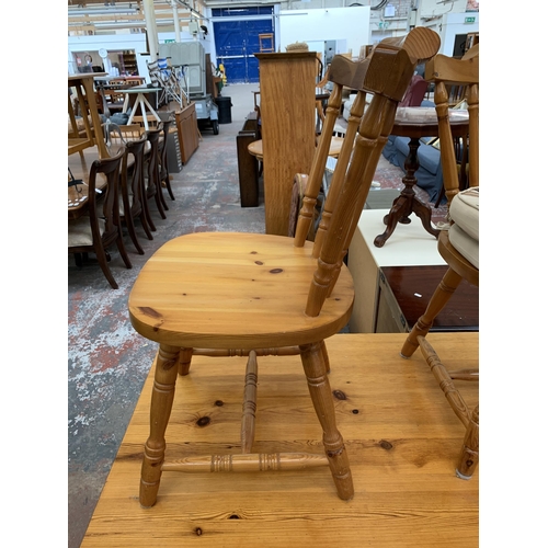 202 - A pine rectangular dining table and four chairs