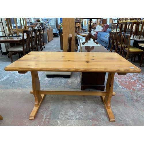 202 - A pine rectangular dining table and four chairs