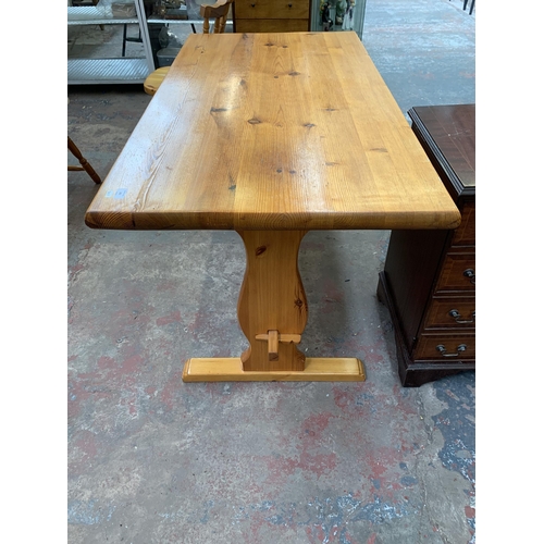 202 - A pine rectangular dining table and four chairs