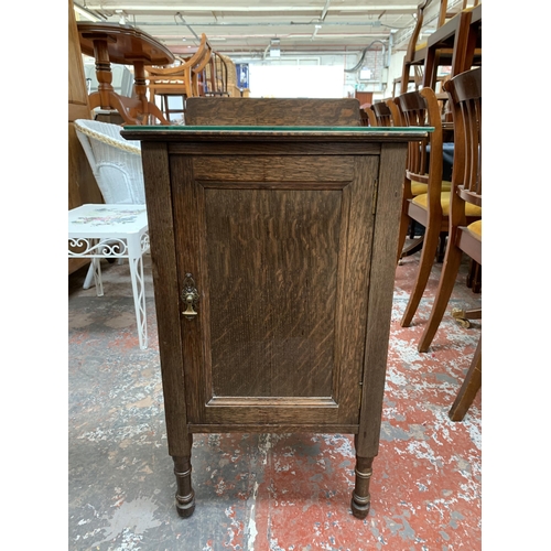 206 - An early 20th century oak bedside cabinet - approx. 80cm high x 43cm wide x 43cm deep