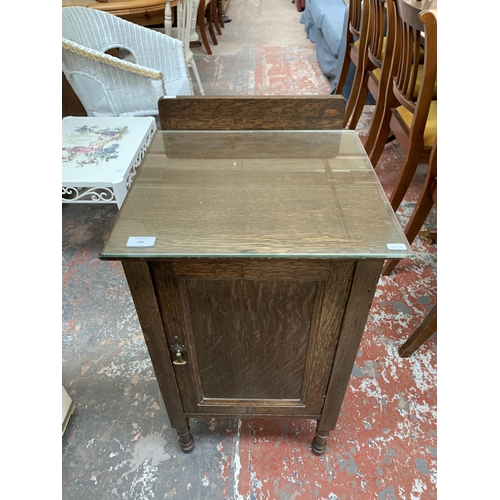 206 - An early 20th century oak bedside cabinet - approx. 80cm high x 43cm wide x 43cm deep