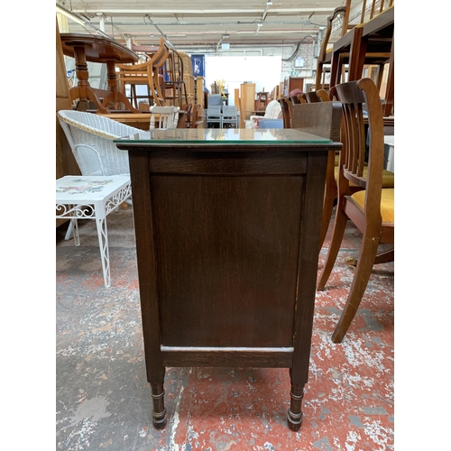 206 - An early 20th century oak bedside cabinet - approx. 80cm high x 43cm wide x 43cm deep