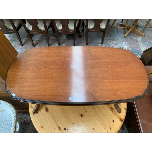 208 - A 19th century style mahogany serpentine twin pedestal coffee table